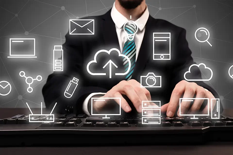 businessman-in-suit-typing-with-multimedia-concept IT Outsourcing Myths: Outsourcing Equals Offloading Responsibility
