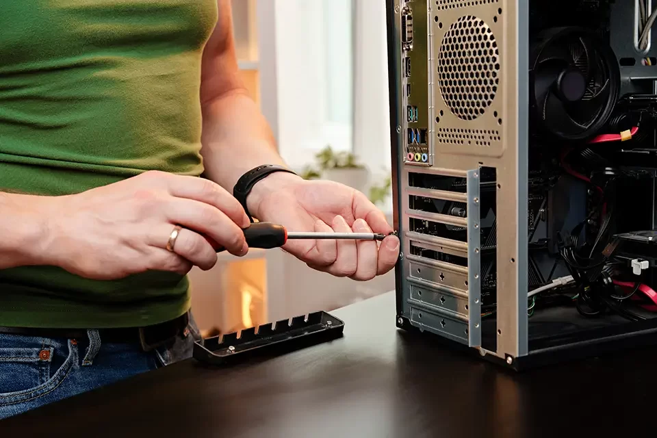 close up of man repairing computer system unit Let us Make Your PC Last Longer in Richmond Hill, Toronto