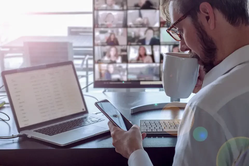 man-sipping-coffee-doing-business-video-chat Our Expertise in Secure VPN Setup for Richmond Hill Businesses
