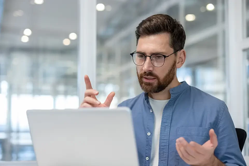 serious-concentrated-man-talking-to-colleagues IT Outsourcing Myths: Cheaper Means Lower Quality