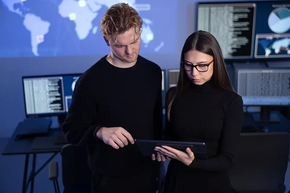 two-professionals-in-cyber-security-team-working Core Layers of Endpoint Security