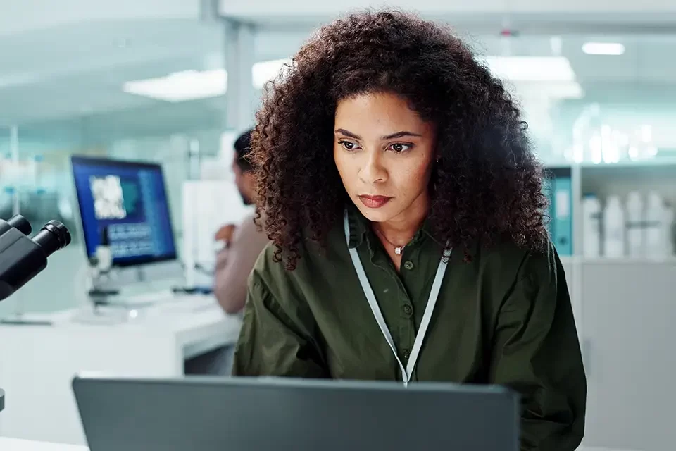 woman-laptop-and-lab-for-research-science What Is Endpoint Security?
